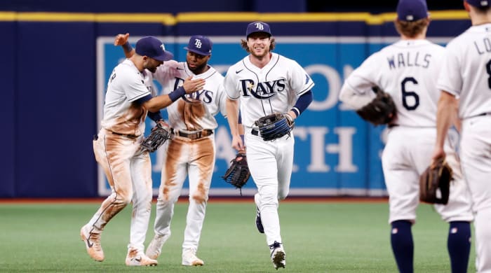 Sep 20, 2021; St. Petersburg, Florida, USA; Tampa Bay Rays right fielder Brett Phillips (35), right fielder Manuel Margot (13), center fielder Kevin Kiermaier (39) and teammates celebrate as they beat the Toronto Blue Jays at Tropicana Field.